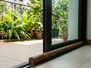 Security bar installed in a sliding door track at a Singapore residential property; a simple and effective additional security measure